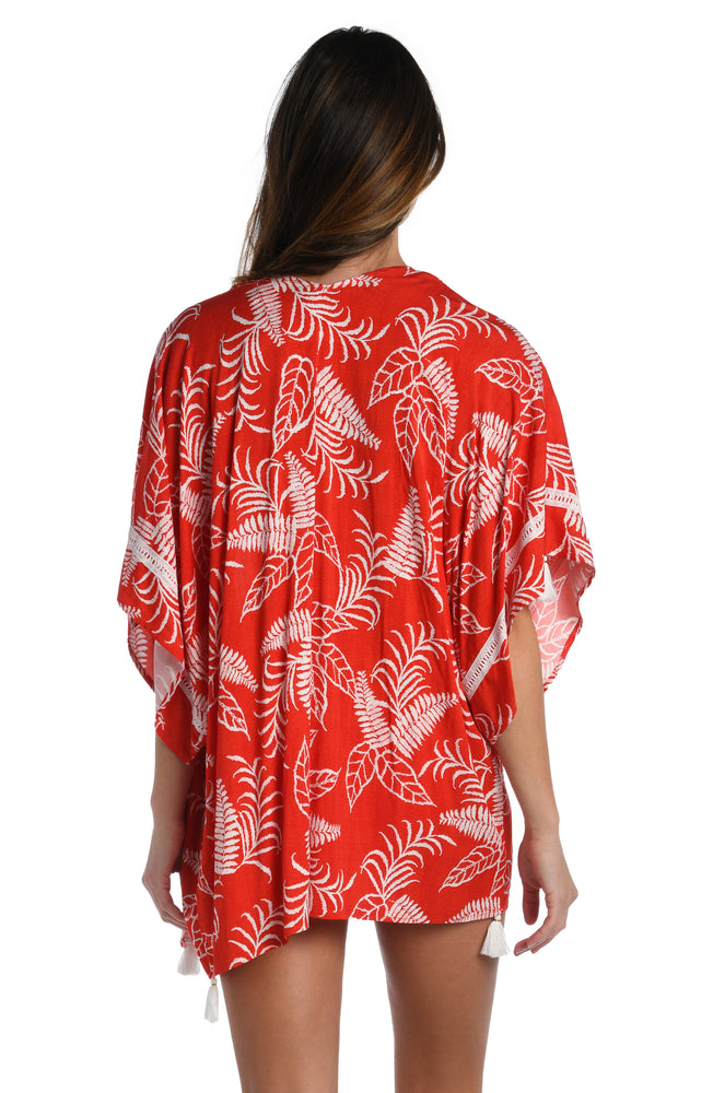 Model is wearing cherry red tropical printed kimono cover up from our Tropical Tapestry collection!