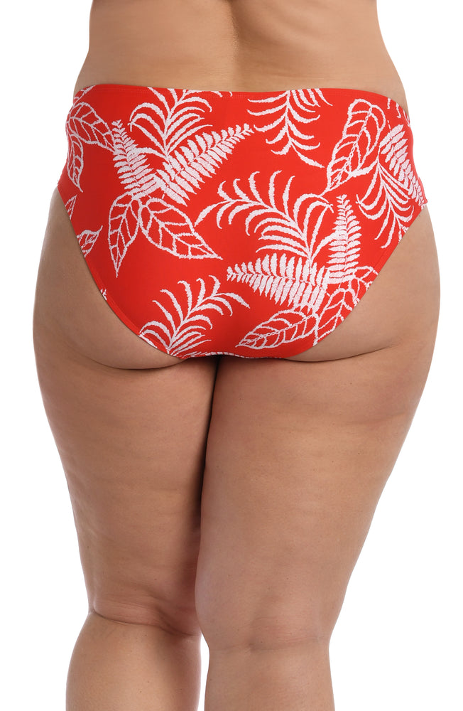 
            
                Load image into Gallery viewer, Model is wearing cherry red tropical printed side shirred hipster bottom from our Tropical Tapestry collection!
            
        