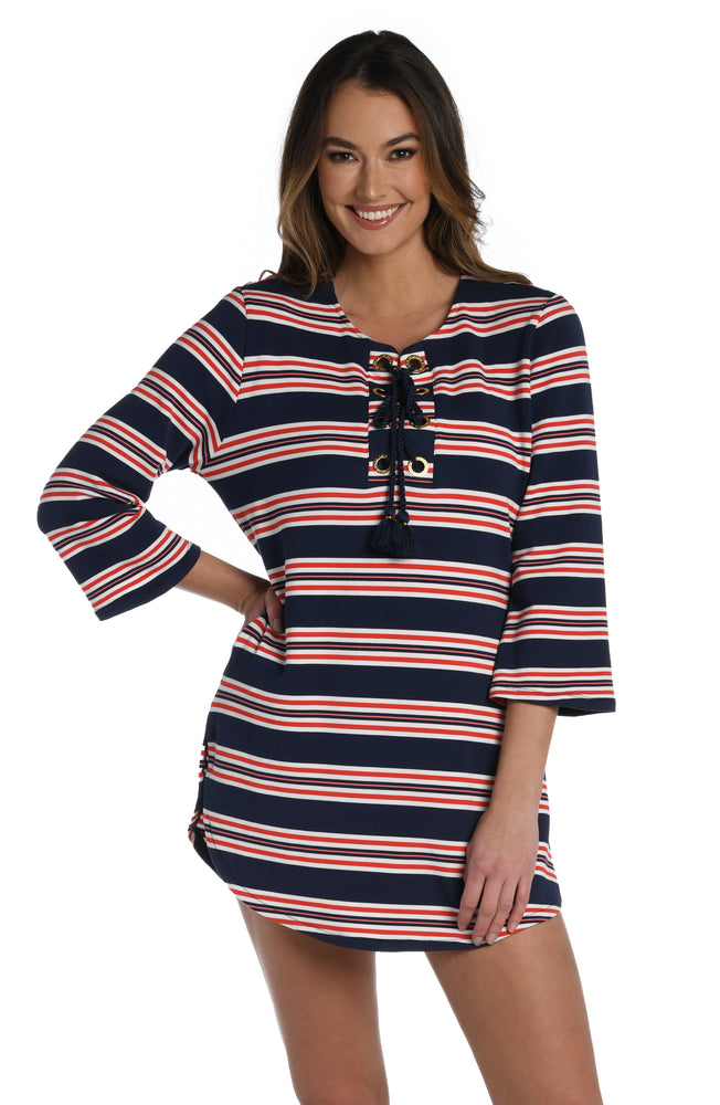 
            
                Load image into Gallery viewer, Model is wearing a red, white, and blue striped patterned v-neck tunic from our Sailor Stripe collection!
            
        