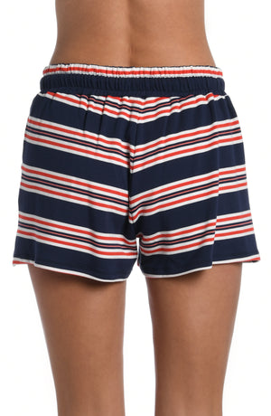 
            
                Load image into Gallery viewer, Model is wearing a red, white, and blue striped patterned beach shorts from our Sailor Stripe collection!
            
        