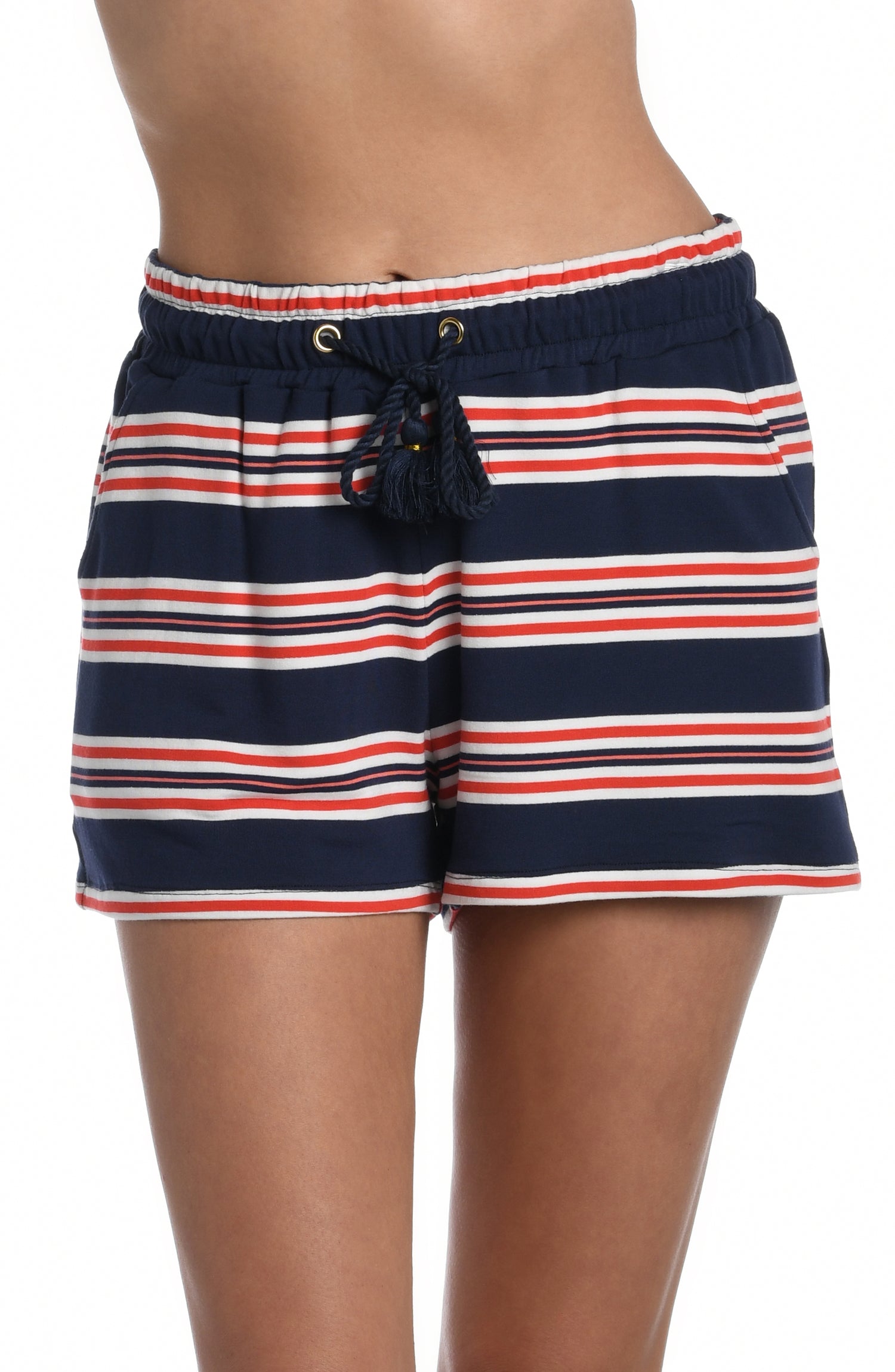 Model is wearing a red, white, and blue striped patterned beach shorts from our Sailor Stripe collection!