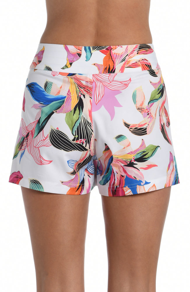 
            
                Load image into Gallery viewer, Model is wearing a multi colored tropical printed 3&amp;quot; inseam boardshort bottom from our Paradise City collection!
            
        