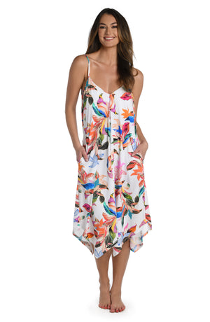 Model is wearing a multi colored tropical printed trapeze dress cover up from our Paradise City collection!