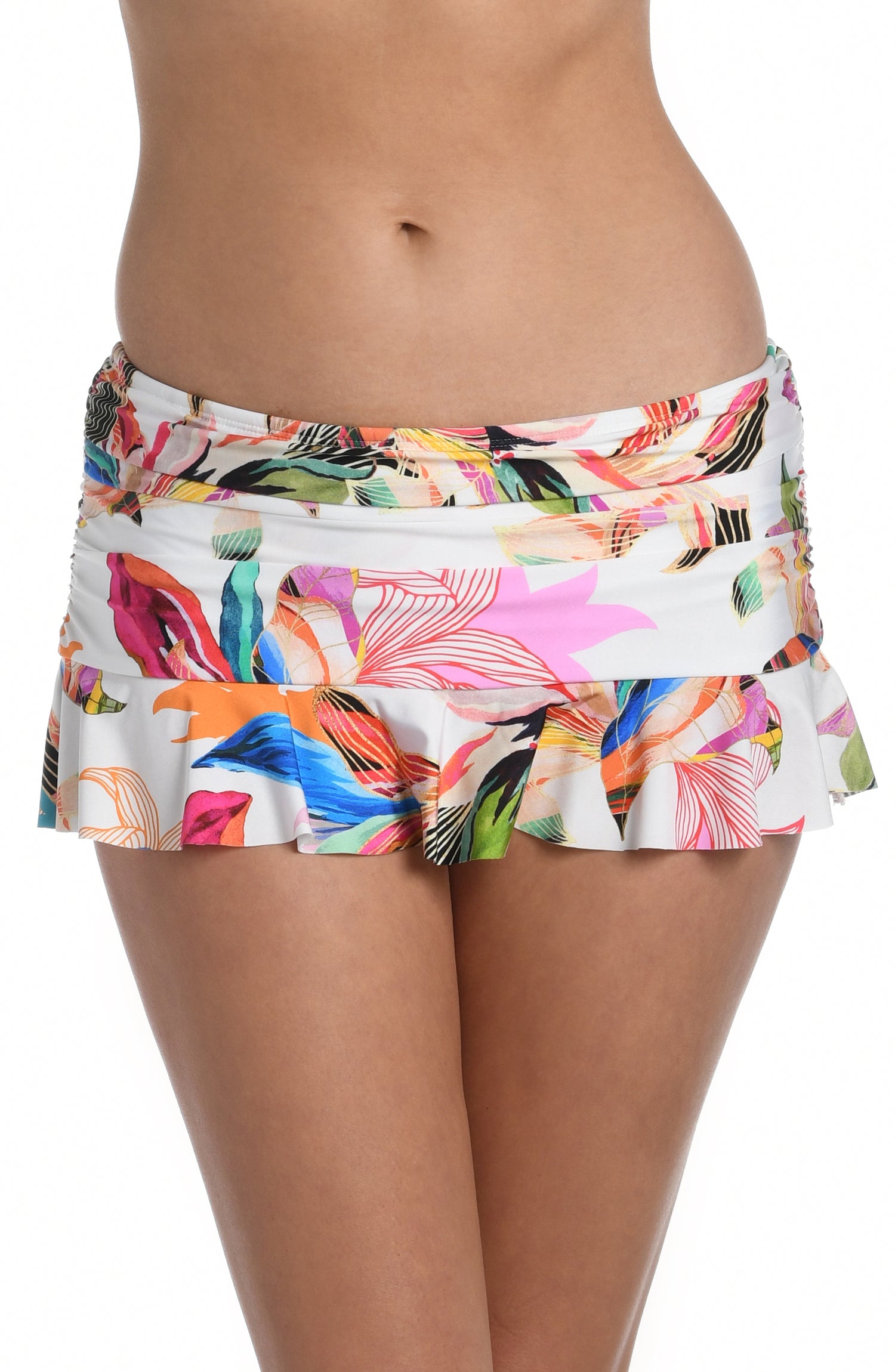 Model is wearing a multi colored tropical printed ruffle skirted bottom from our Paradise City collection!