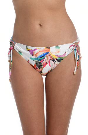 
            
                Load image into Gallery viewer, Model is wearing a multi colored tropical printed side tie hipster bottom from our Paradise City collection!
            
        