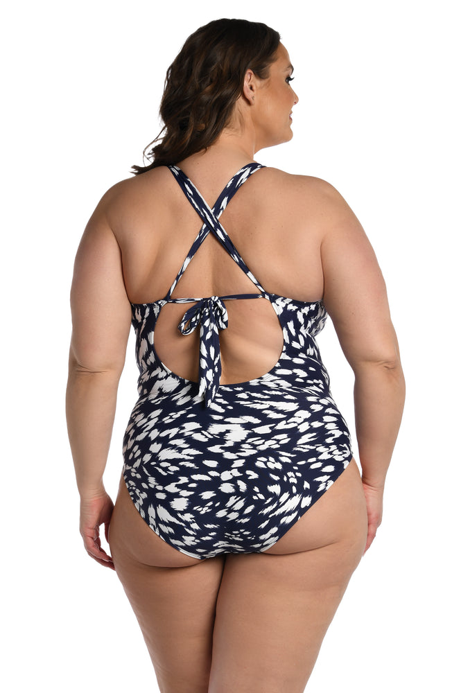
            
                Load image into Gallery viewer, Model is wearing a indigo blue colored print with pops of white on this high neck keyhole one piece from our Changing Tides collection!
            
        