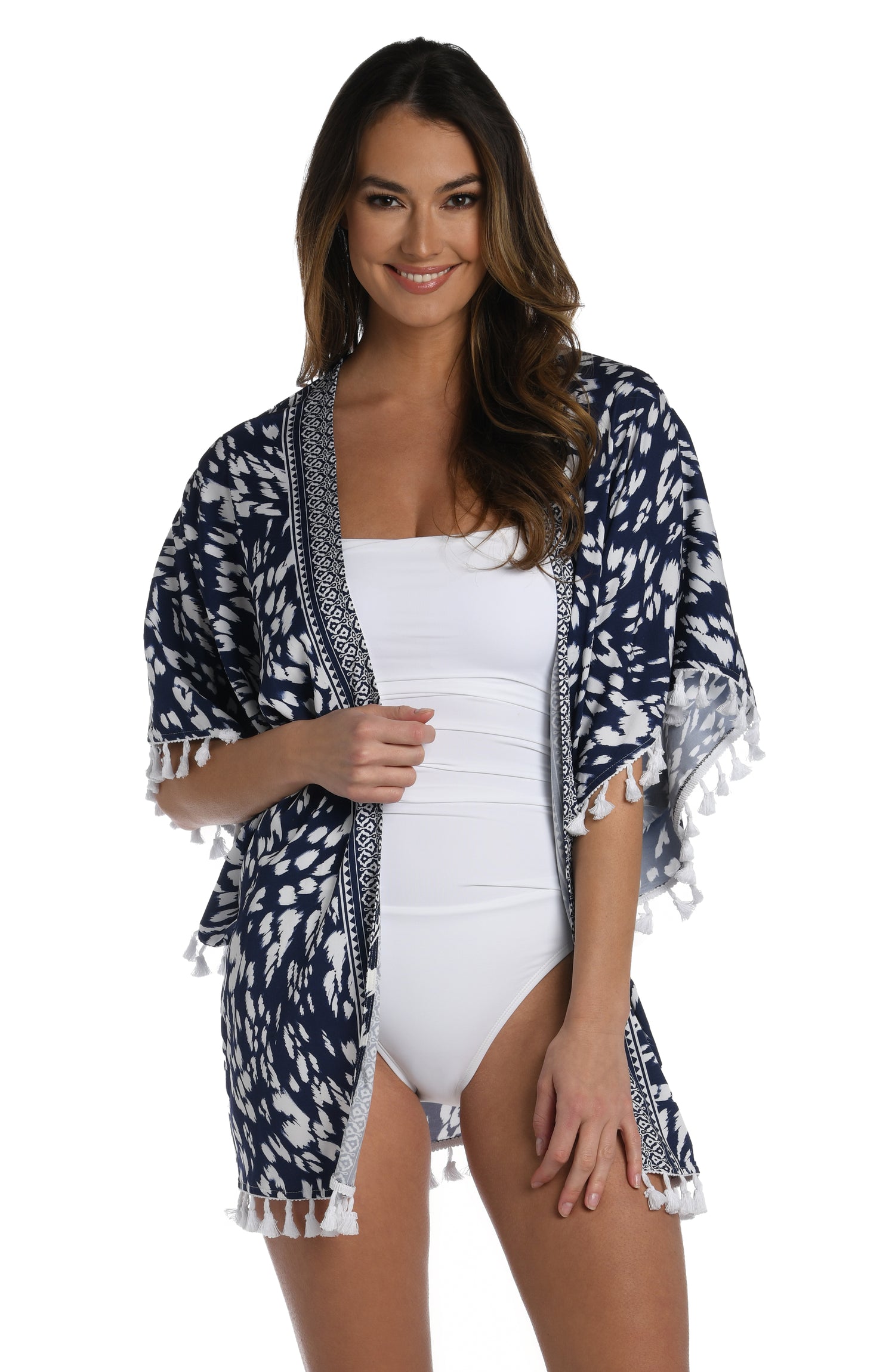 Model is wearing a indigo blue colored print with pops of white on this kimono cover up from our Changing Tides collection!