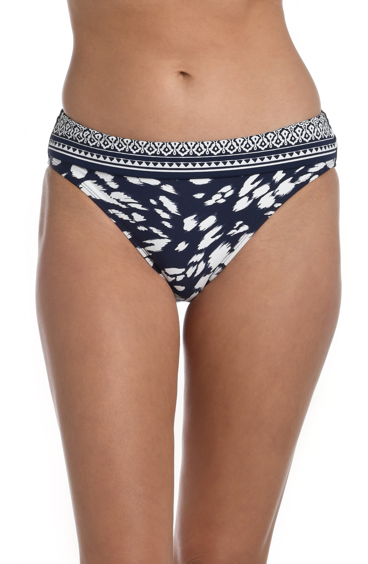 Model is wearing a indigo blue colored print with pops of white on this shirred band hipster bottom from our Changing Tides collection!