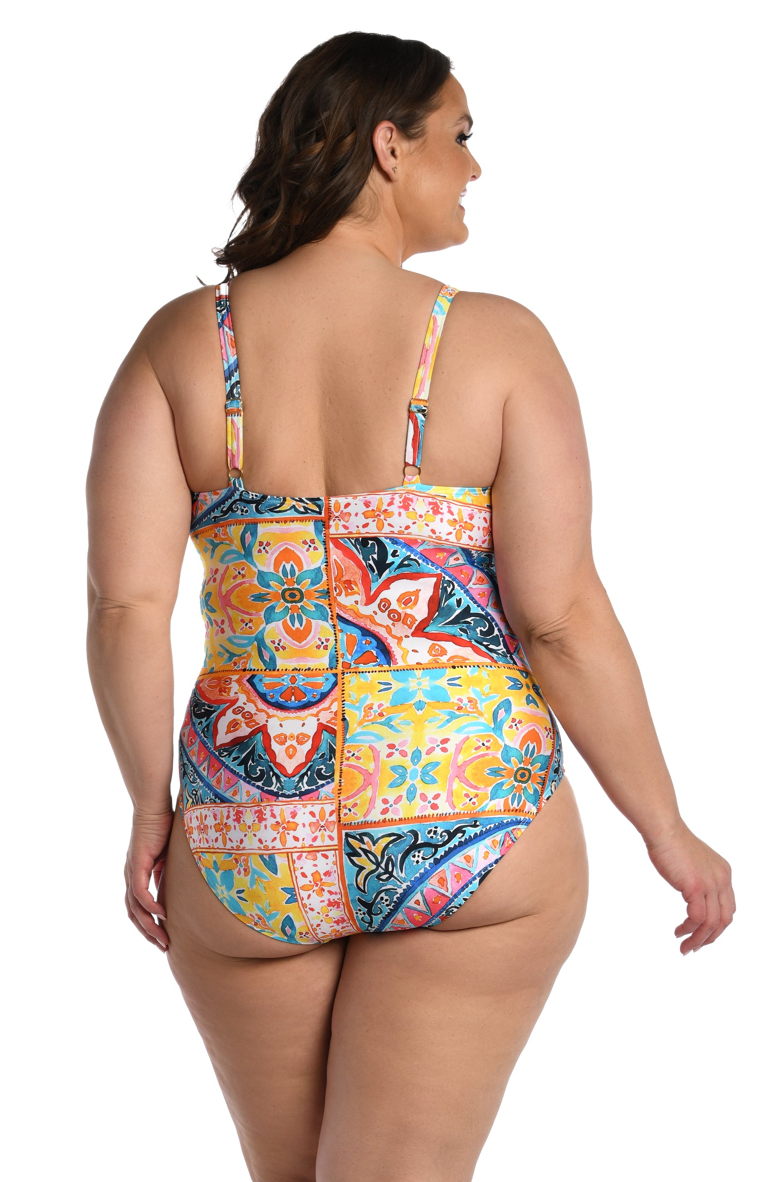 Model is wearing a moroccan inspired multi colored printed lingerie one piece from our Soleil collection!