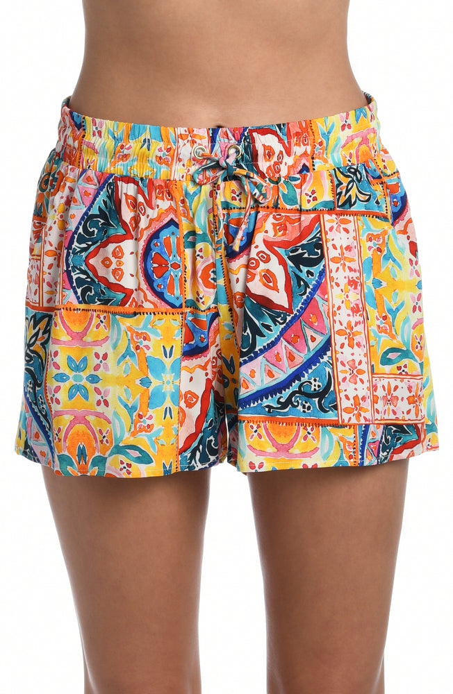 
            
                Load image into Gallery viewer, Model is wearing a moroccan inspired multi colored printed beach shorts cover up from our Soleil collection!
            
        