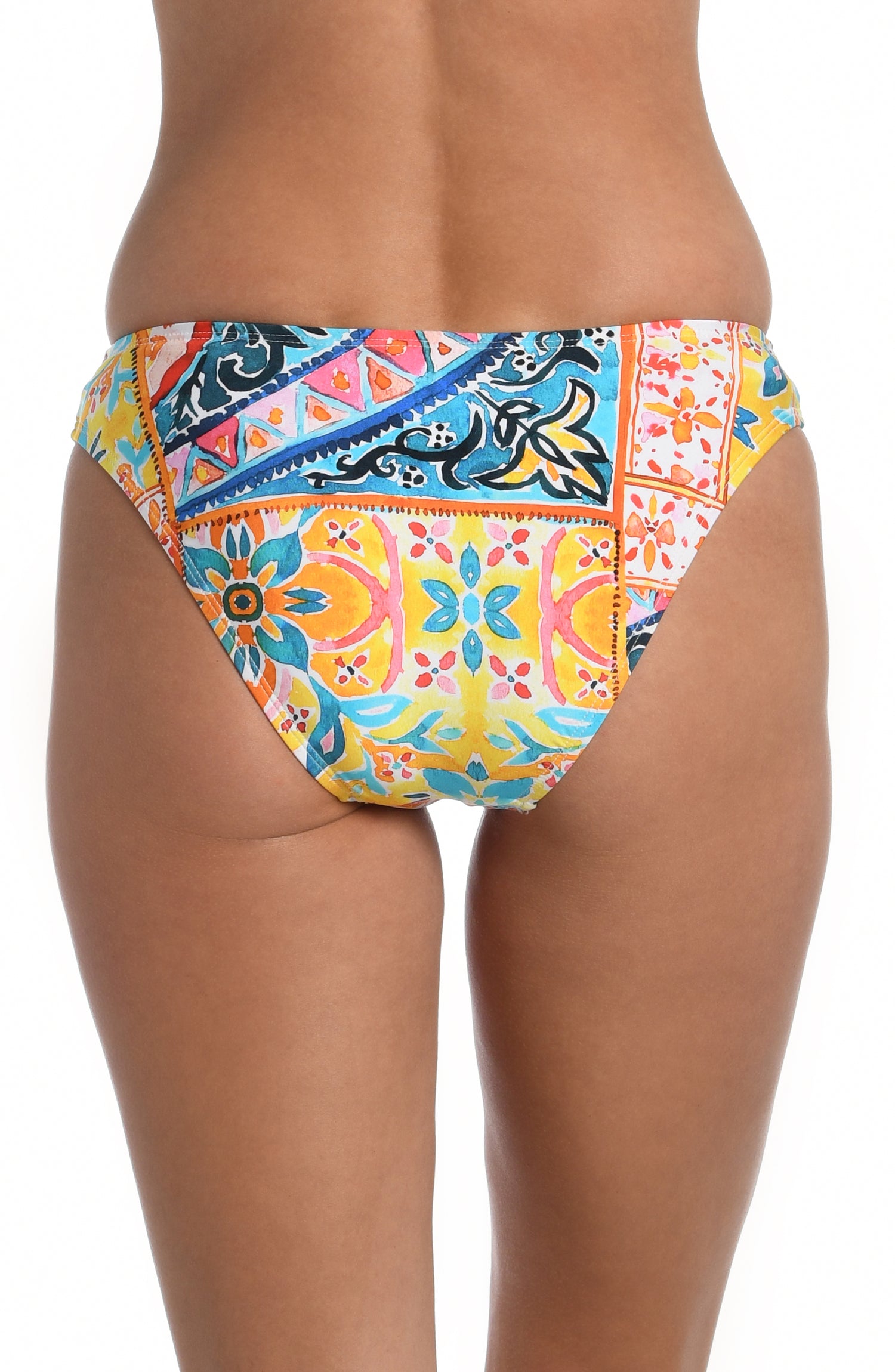 Model is wearing a moroccan inspired multi colored printed hipster bottom from our Soleil collection!