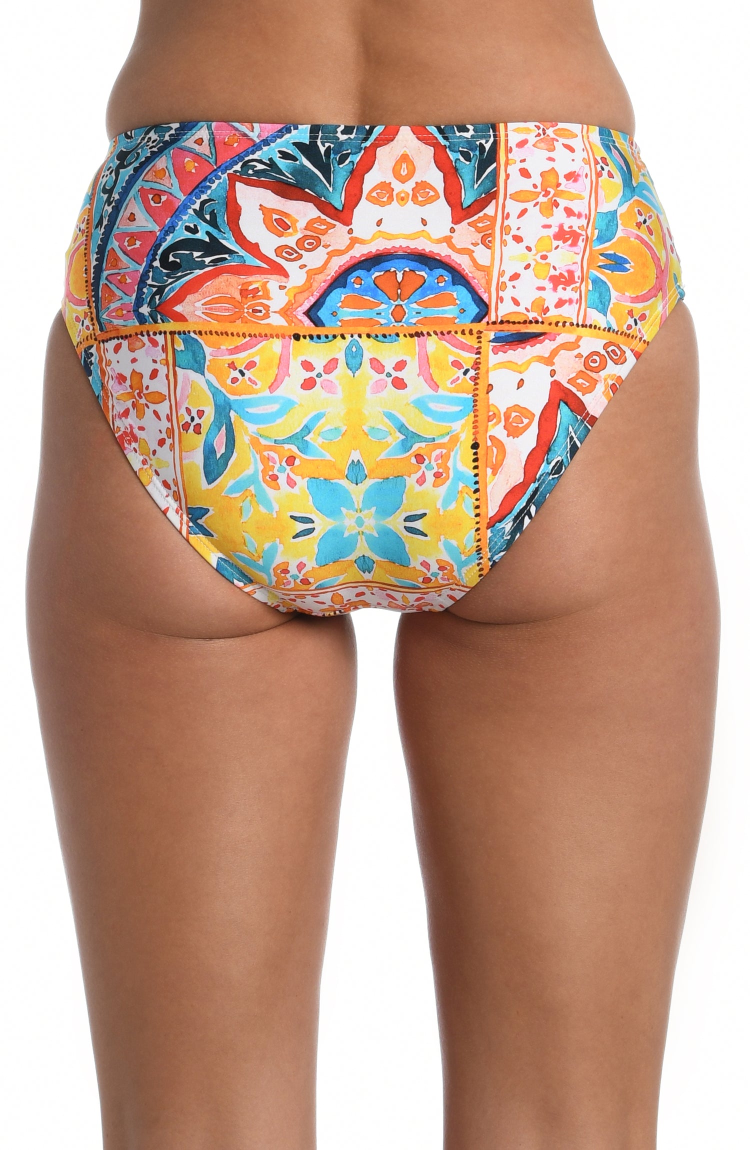 Model is wearing a moroccan inspired multi colored printed mid waist bottom from our Soleil collection!