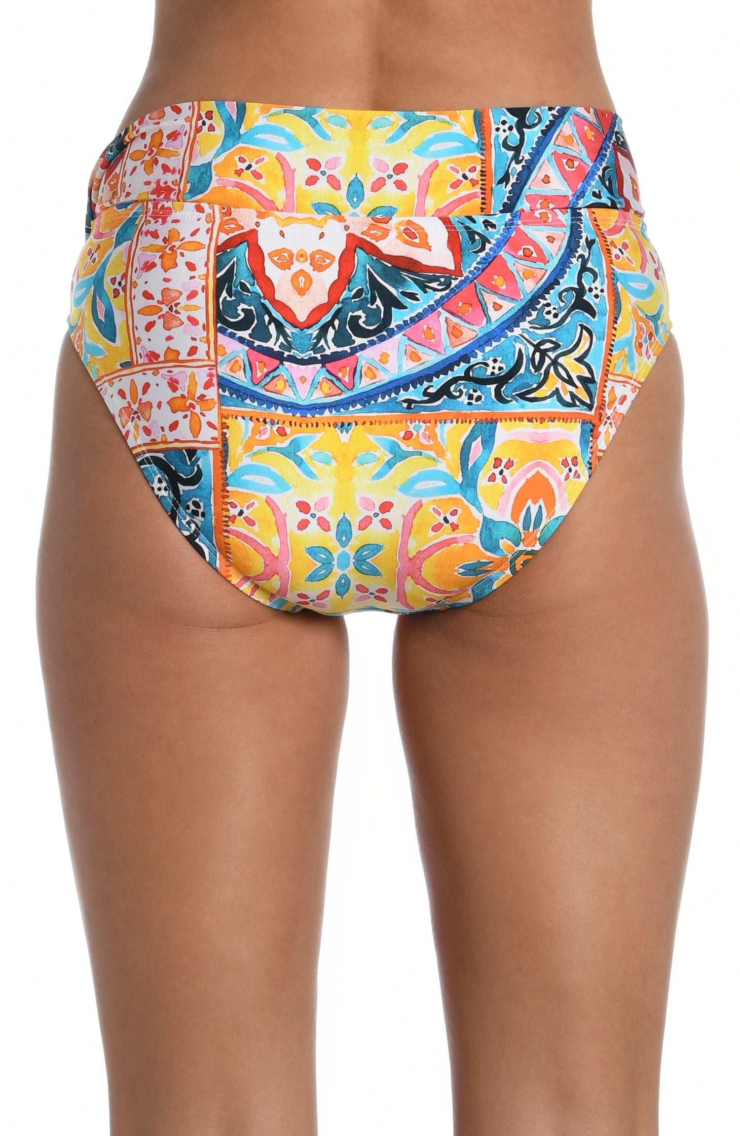 Model is wearing a moroccan inspired multi colored printed high waist bottom from our Soleil collection!