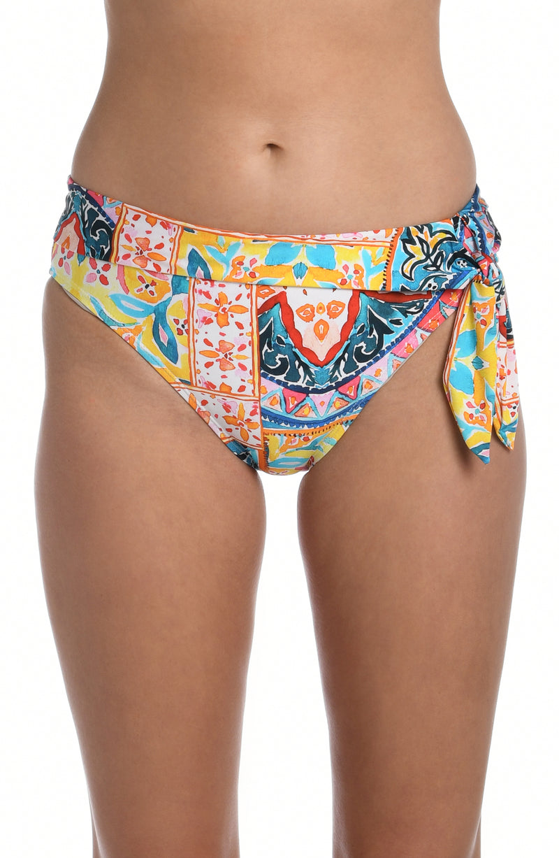 Model is wearing a moroccan inspired multi colored printed high waist bottom from our Soleil collection!