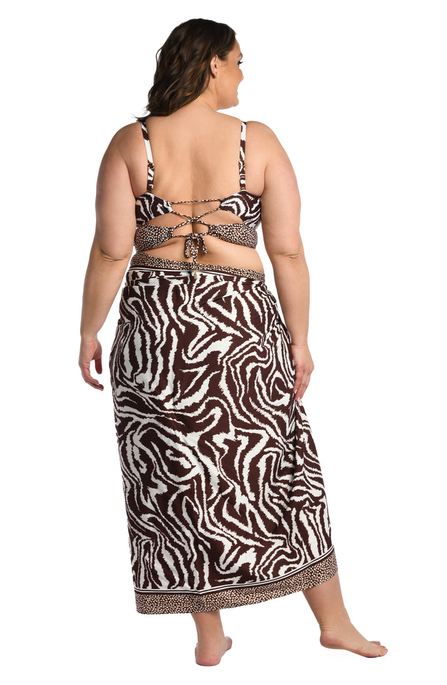 
            
                Load image into Gallery viewer, Model is wearing a java colored animal printed pareo wrap cover up in our Fierce Lines collection!
            
        