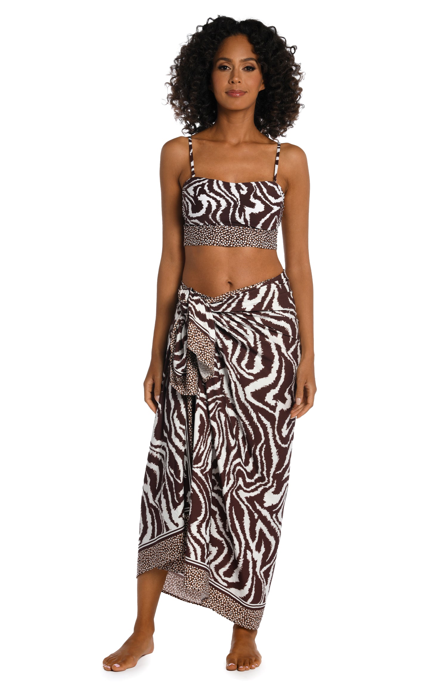 Model is wearing a java colored animal printed pareo wrap cover up in our Fierce Lines collection!