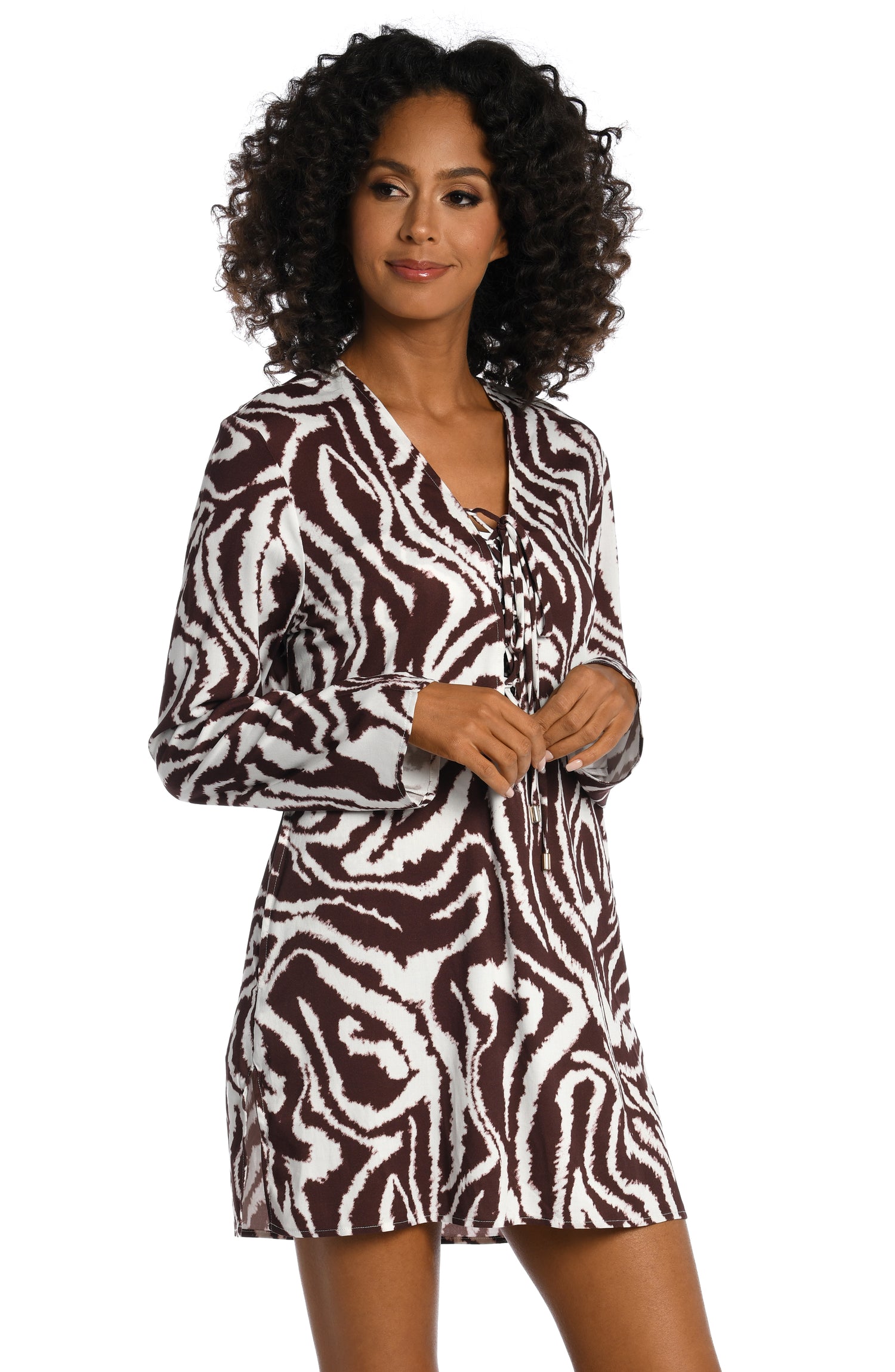 Model is wearing a java colored animal printed v-neck tunic cover up in our Fierce Lines collection!