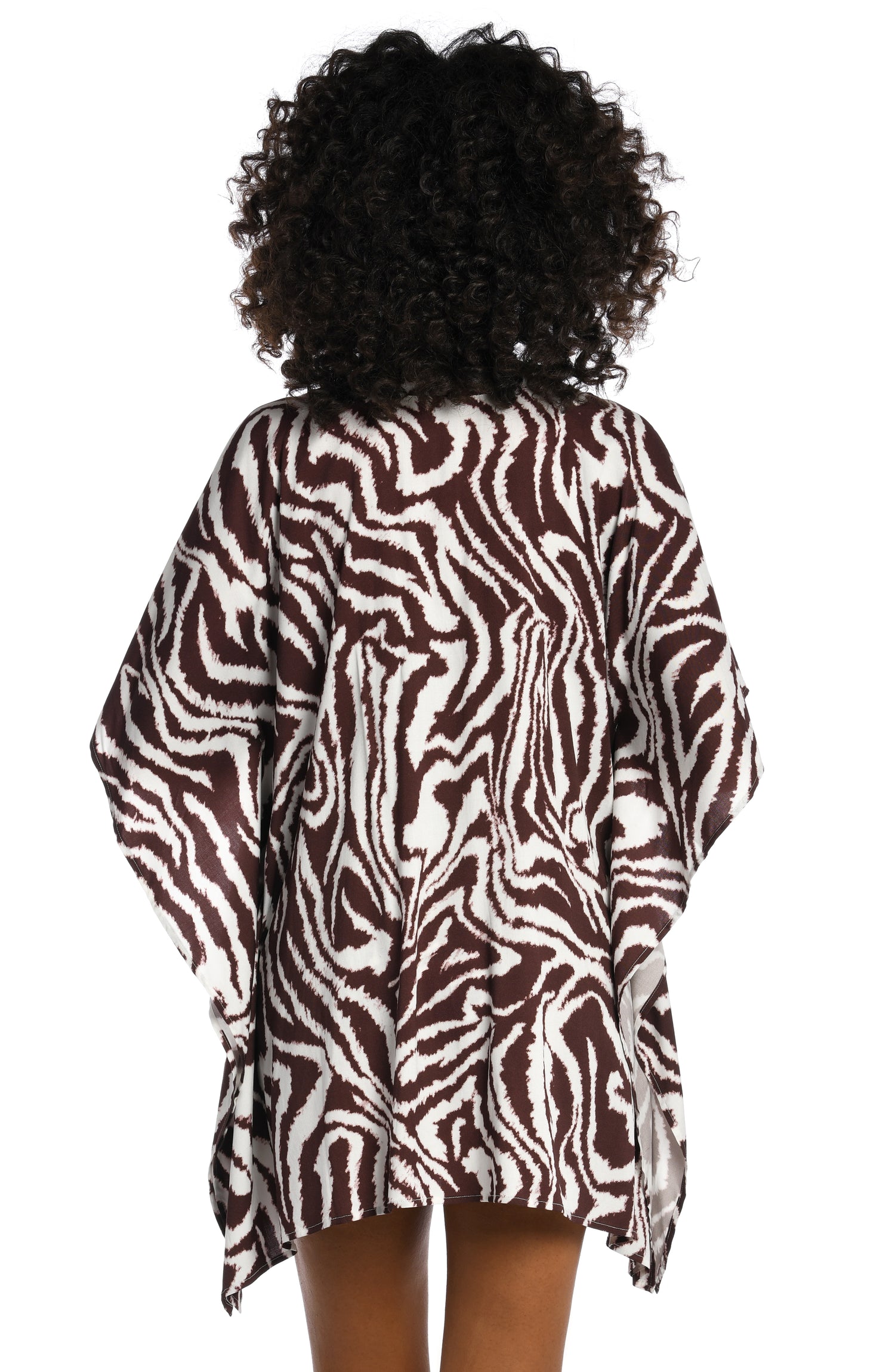 Model is wearing a java colored animal printed v-neck caftan wrap cover up in our Fierce Lines collection!
