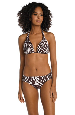 Model is wearing a java colored animal printed halter triangle top in our Fierce Lines collection!