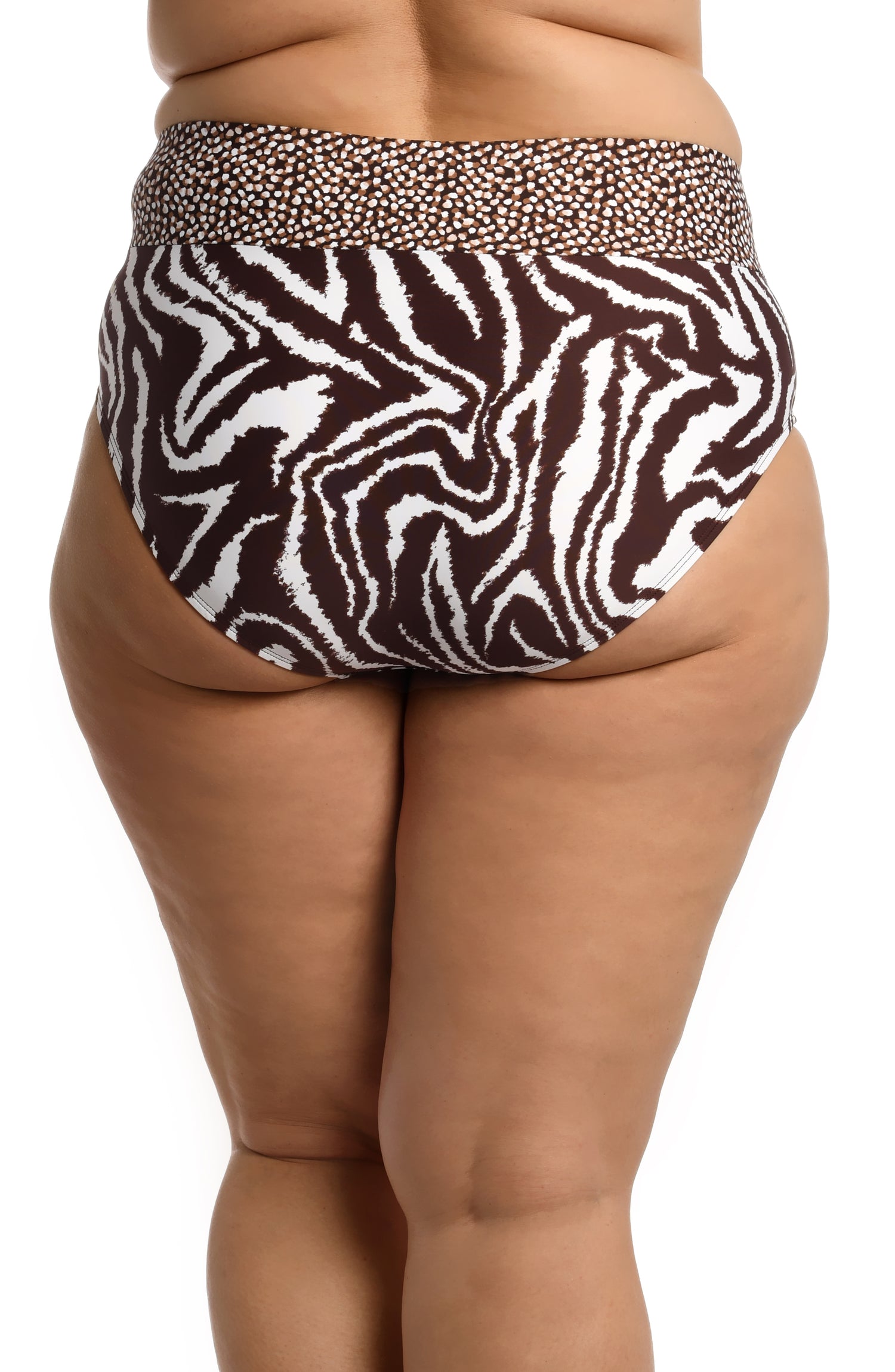 Model is wearing a java colored animal printed crossover high waisted bottom in our Fierce Lines collection!