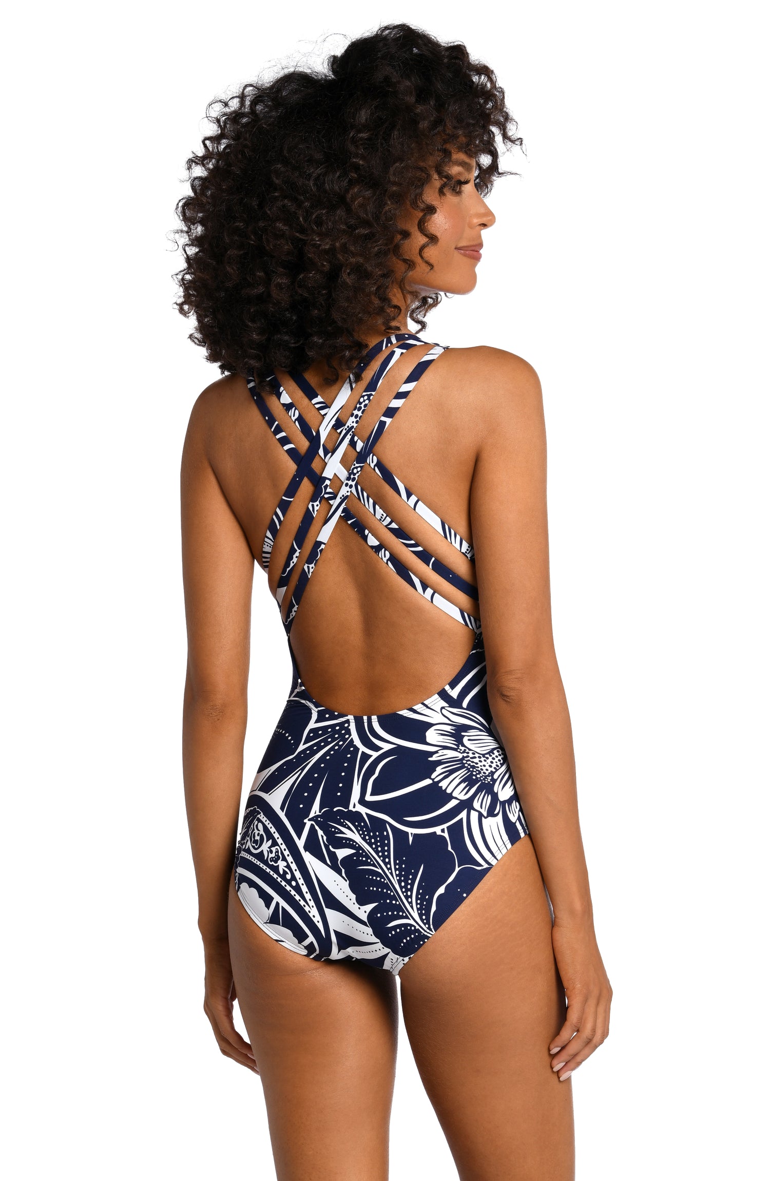 Model is wearing an indigo colored print with pops of white on this multi-strap crossback one piece from our At the Playa collection!