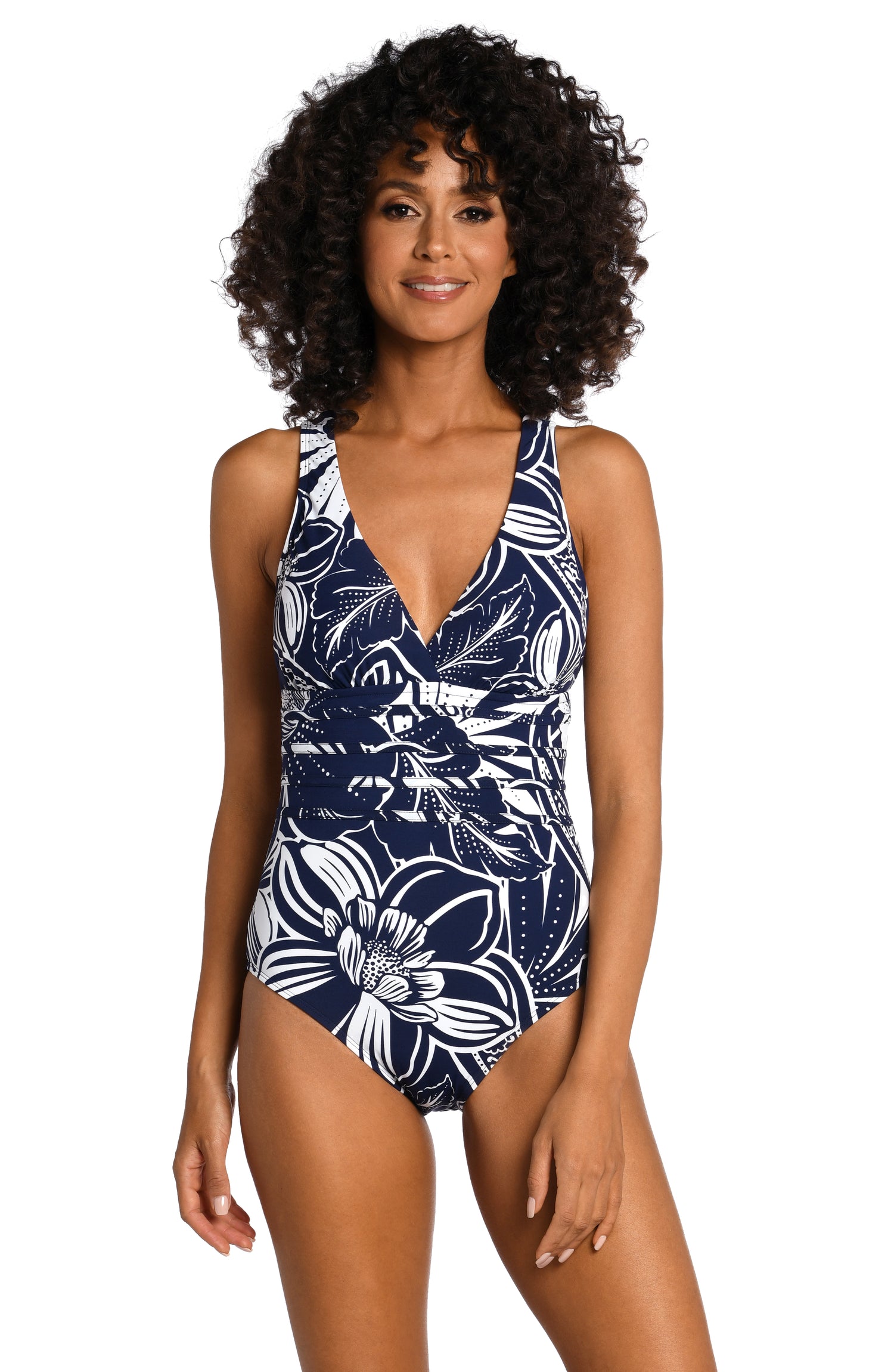 Model is wearing an indigo colored print with pops of white on this multi-strap crossback one piece from our At the Playa collection!