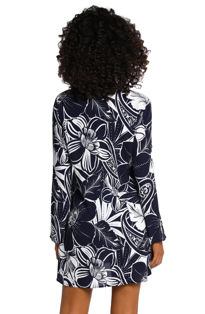 
            
                Load image into Gallery viewer, Model is wearing an indigo colored print with pops of white on this v-neck tunic cover up from our At the Playa collection!
            
        