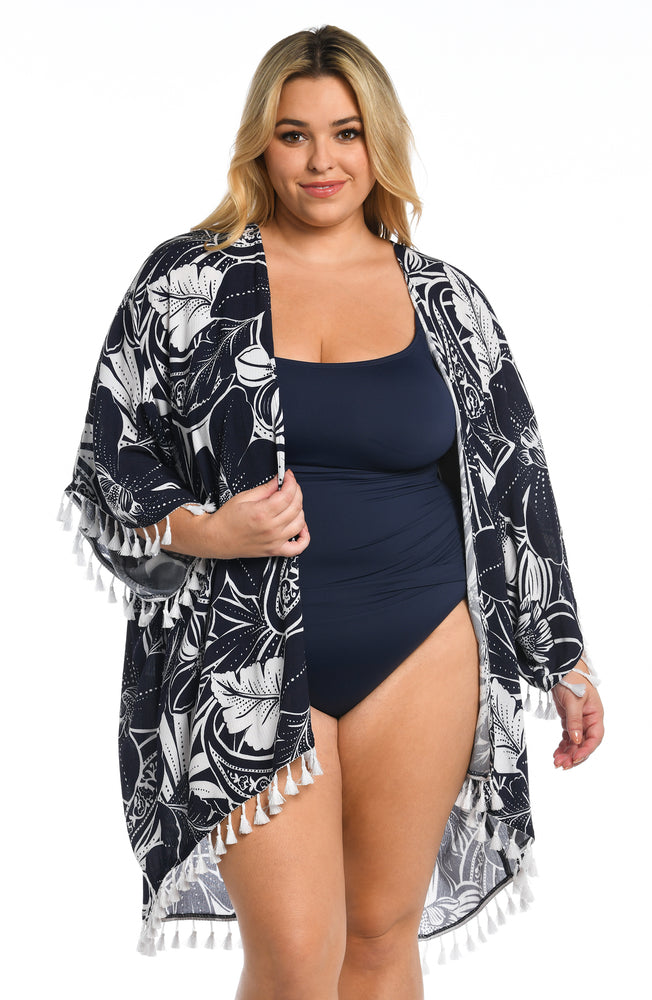 Model is wearing an indigo colored print with pops of white on this kimono cover up from our At the Playa collection!