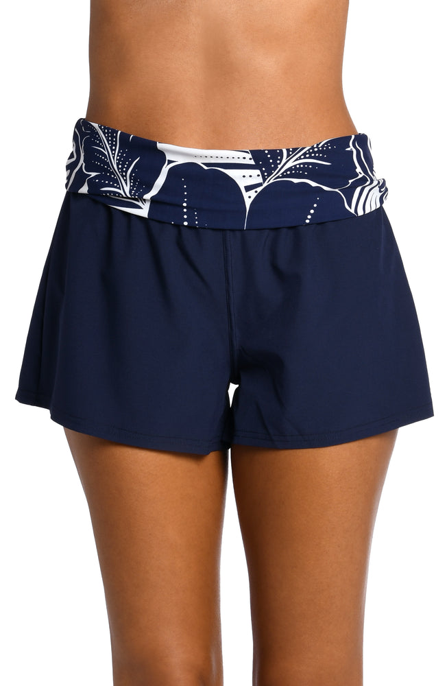 
            
                Load image into Gallery viewer, Model is wearing an indigo colored print with pops of white on 3&amp;quot;inseam board short bottom from our At the Playa collection!
            
        