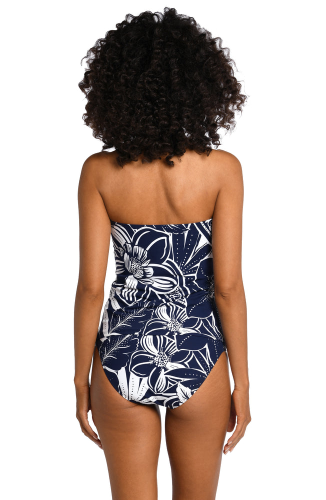 
            
                Load image into Gallery viewer, Model is wearing an indigo colored print with pops of white on bandeau tankini top from our At the Playa collection!
            
        