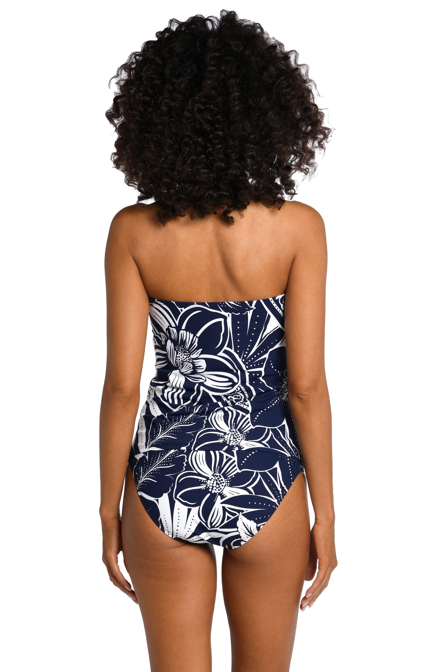 Model is wearing an indigo colored print with pops of white on bandeau tankini top from our At the Playa collection!