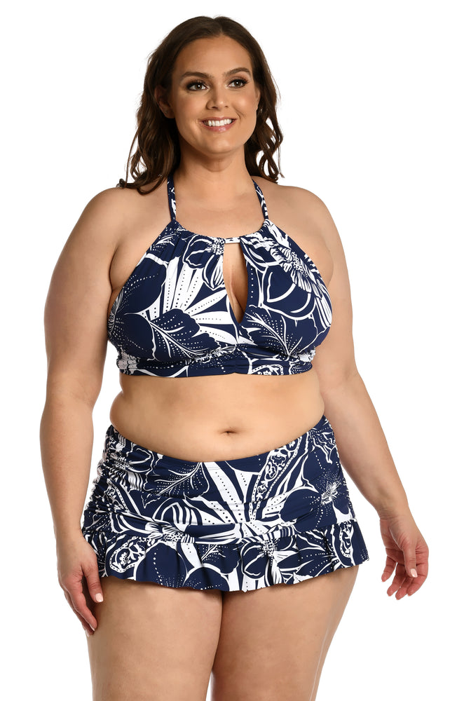 Model is wearing an indigo colored print with pops of white on this high neck midkini top from our At the Playa collection!