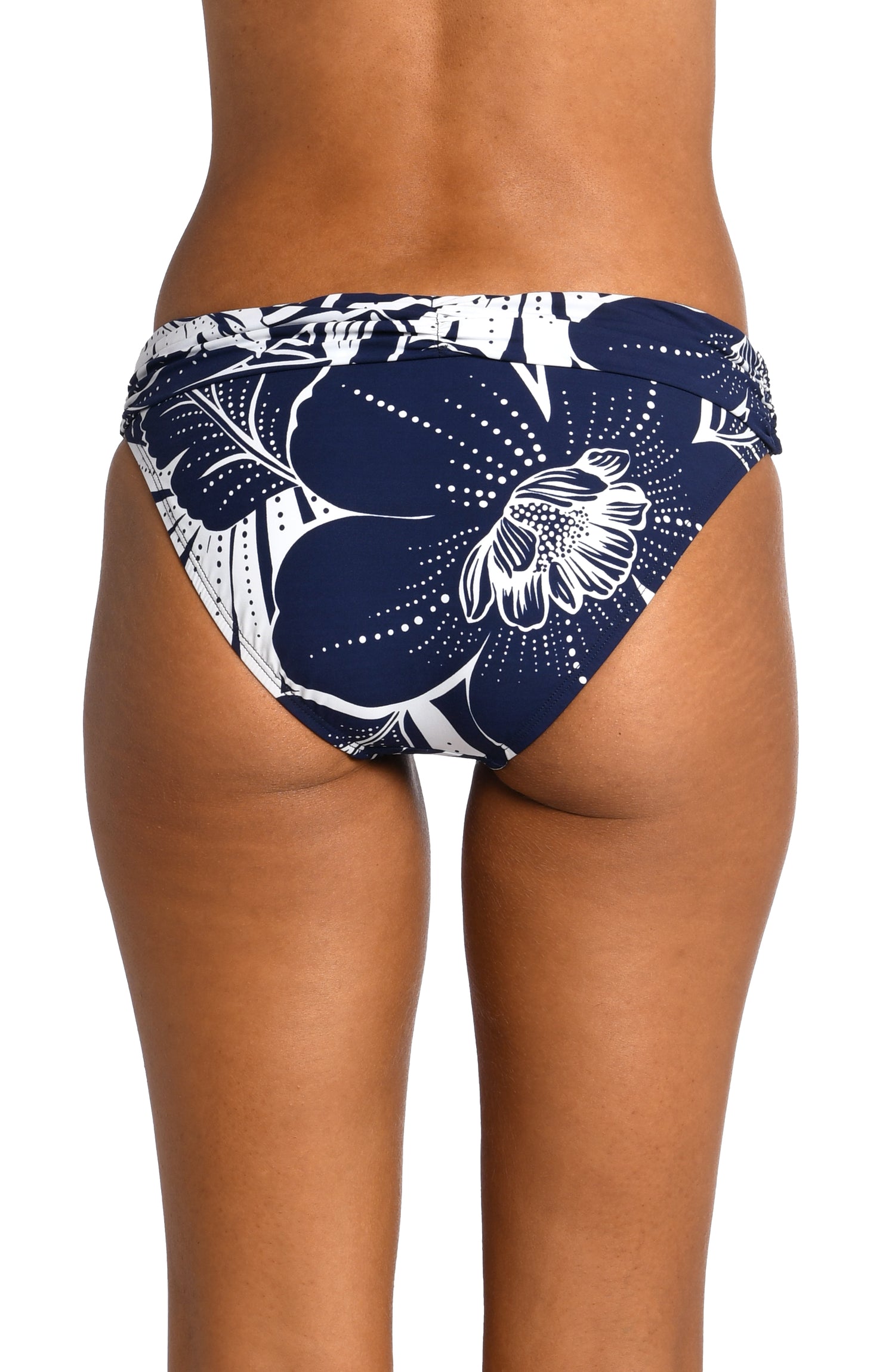 Model is wearing an indigo colored print with pops of white on shirred band hipster bottom from our At the Playa collection!
