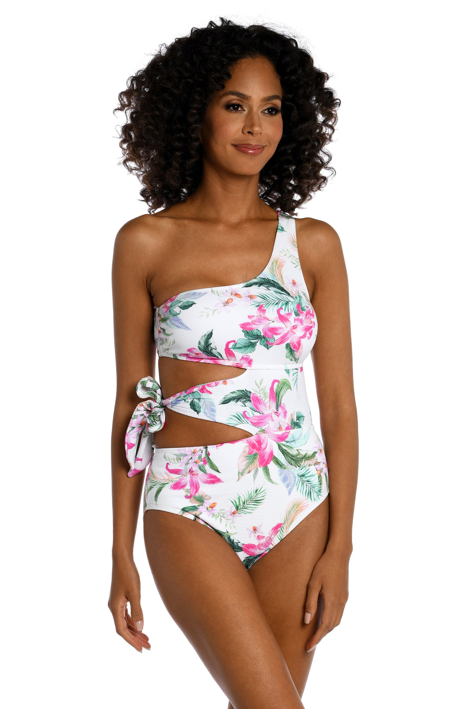 Model is wearing multi colored tropical print on a white backround with this one shoulder one piece from our Mystic Palms collection!
