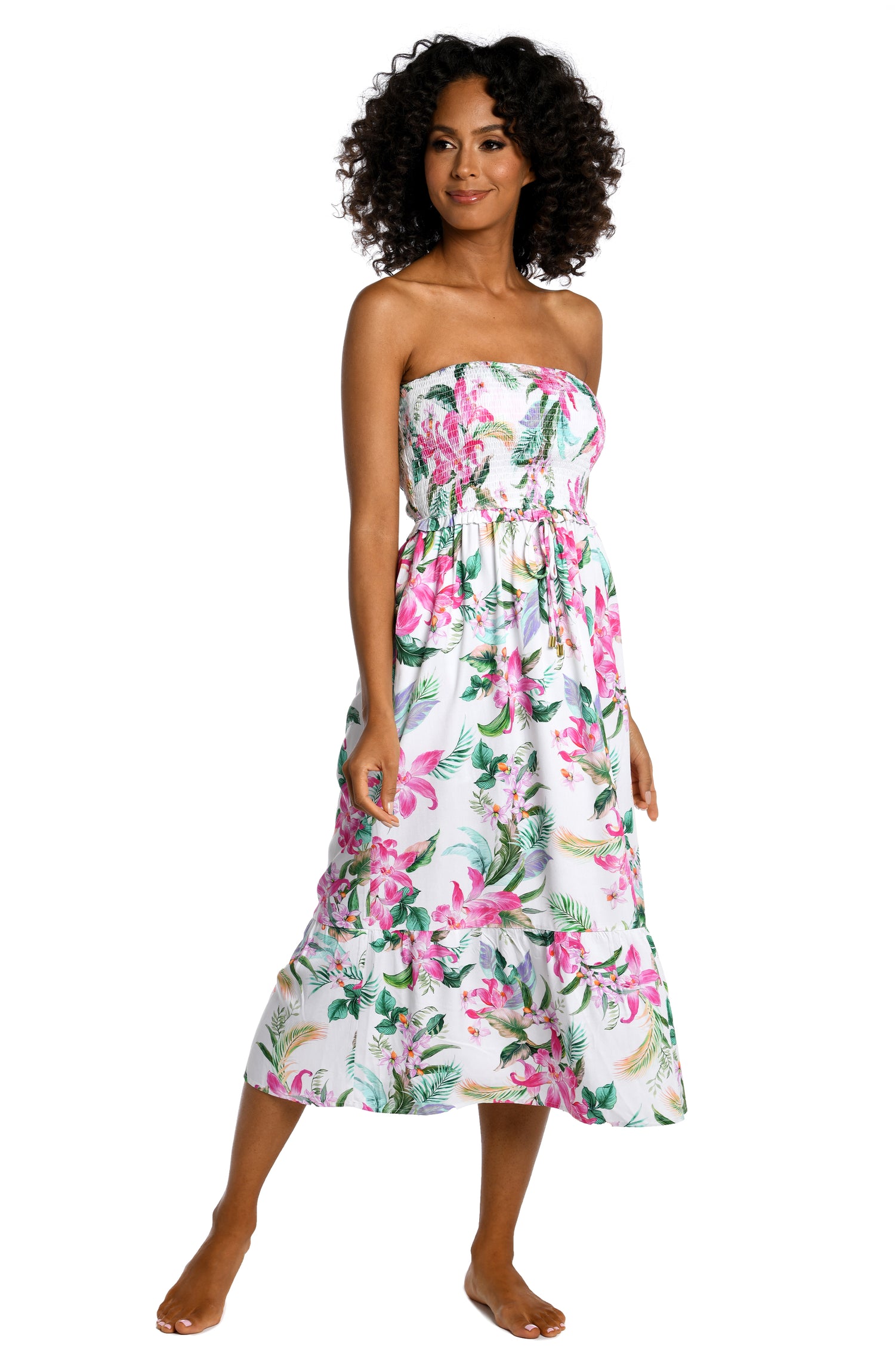Model is wearing multi colored tropical print on a white backround with this strapless midi dress cover up from our Mystic Palms collection!