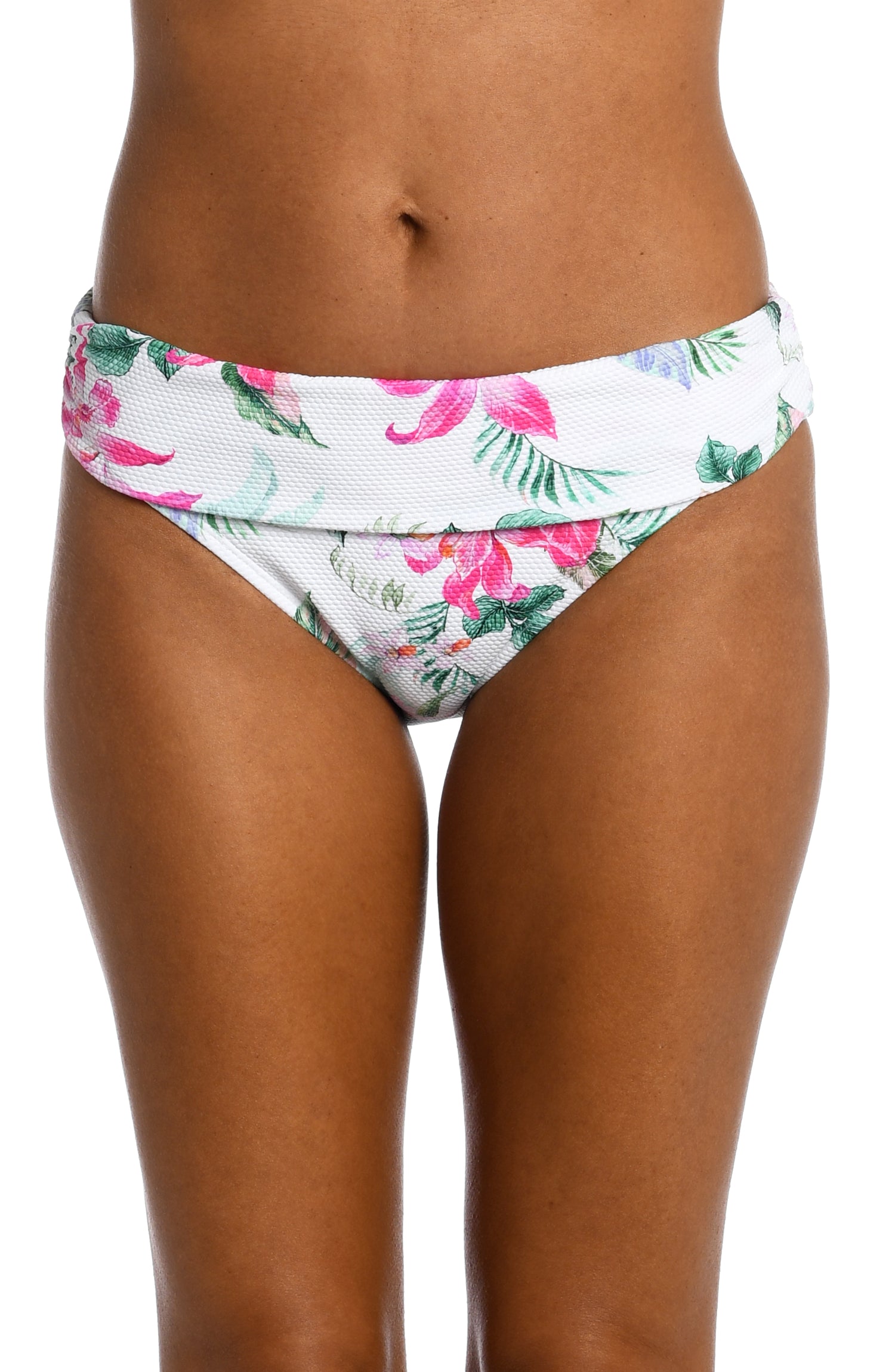 Model is wearing multi colored tropical print on a white backround with this shirred band hipster bottom from our Mystic Palms collection!