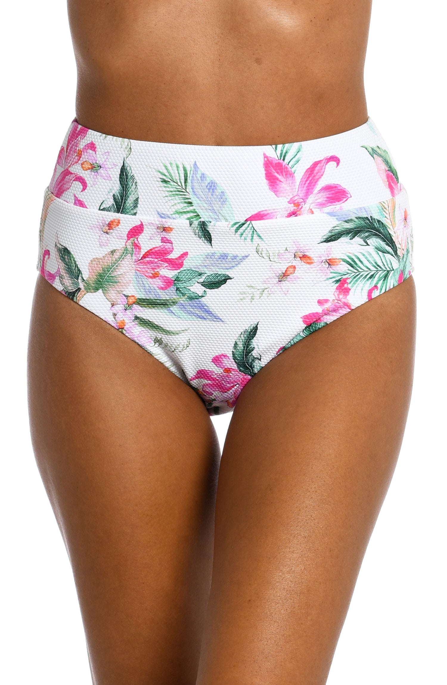 Model is wearing multi colored tropical print on a white backround with this high waist bottom from our Mystic Palms collection!