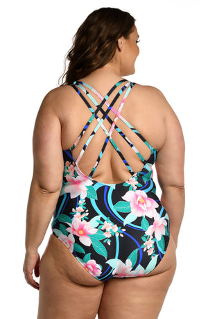 Model is wearing pink multi colored tropical foral print on this multi-strap crossback one piece from our Nightfall Blooms collection!