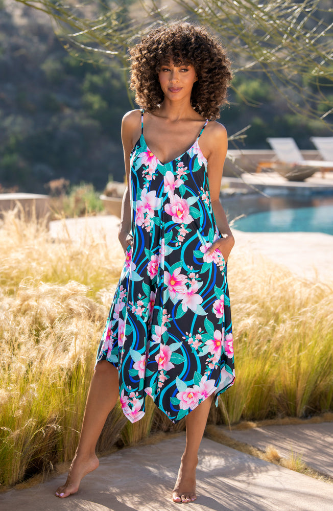 Model is wearing pink multi colored tropical foral print on this trapeze dress cover up from our Nightfall Blooms collection!