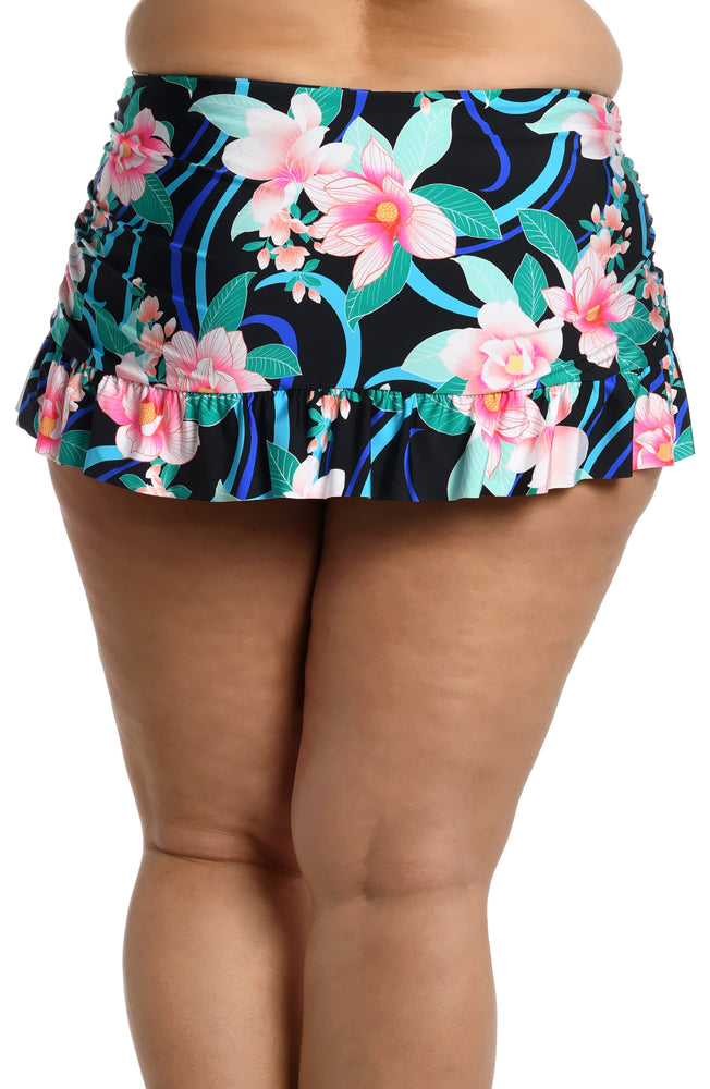 Model is wearing pink multi colored tropical foral print on this ruffle skirted bottom from our Nightfall Blooms collection!