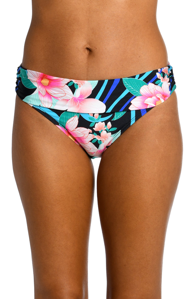 
            
                Load image into Gallery viewer, Model is wearing pink multi colored tropical foral print on this shirred band hipster from our Nightfall Blooms collection!
            
        