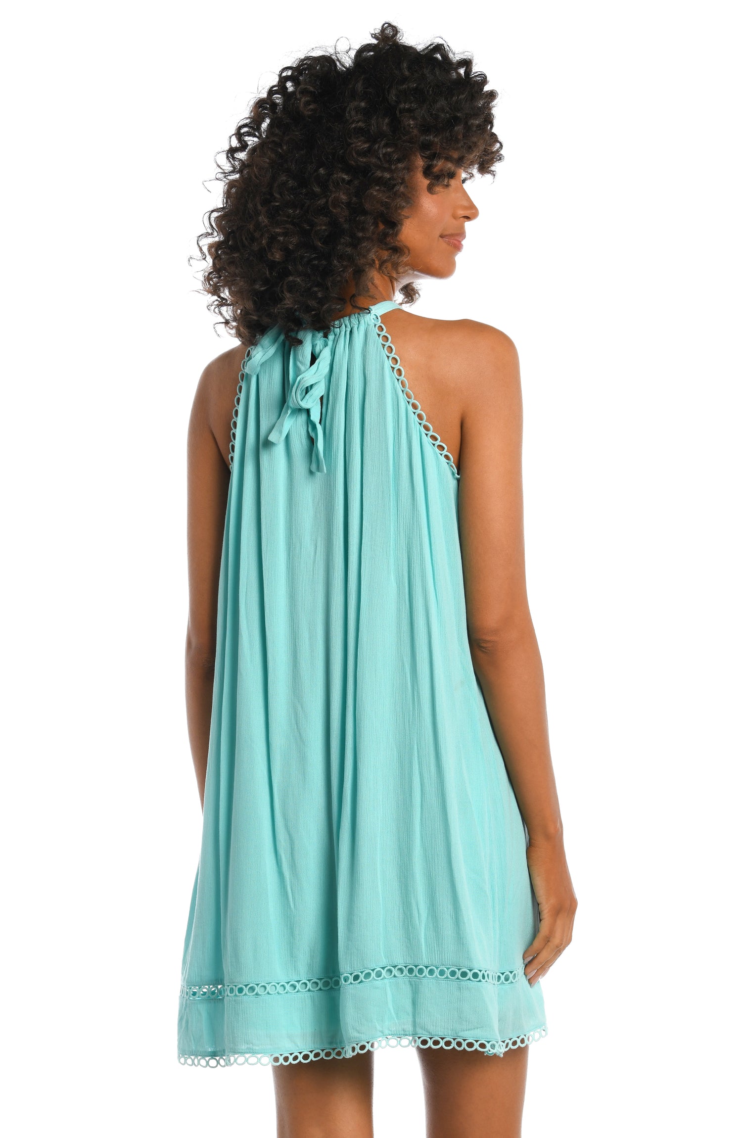 Model is wearing a ice blue colored dress cover up from our Illusion Covers collection!