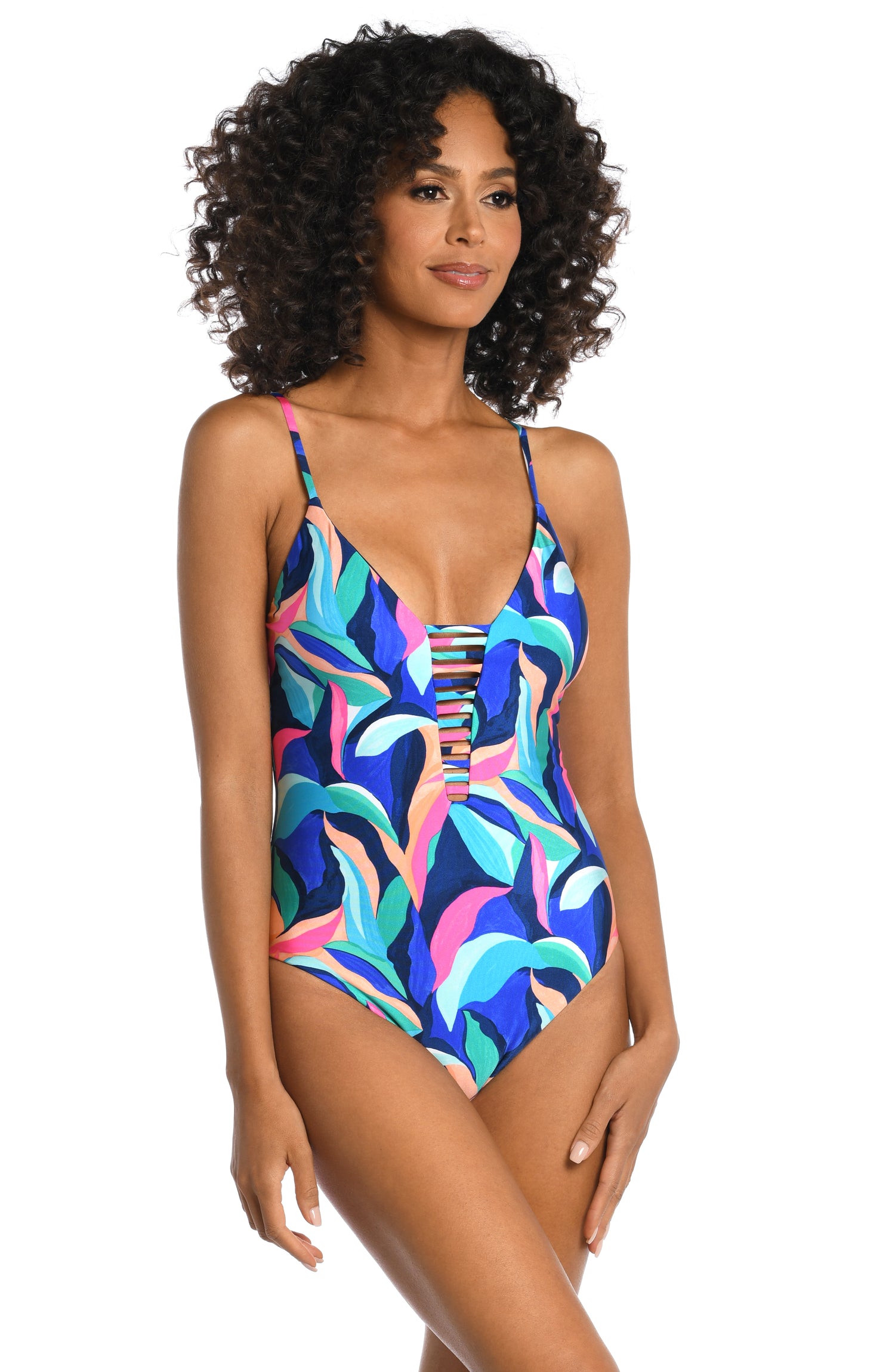 Model is wearing a bold paint-like stroke of vibrant dark colors printed on this plunge one piece from our Painted Leaves collection!