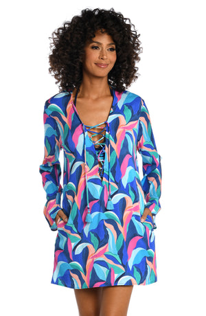 Model is wearing a bold paint-like stroke of vibrant dark colors printed on this v-neck tunic cover up from our Painted Leaves collection!