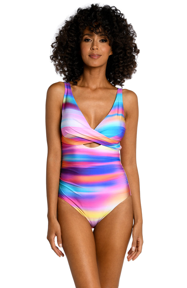 Model is wearing a multi colored ombre printed keyhole one piece from our Sunset Shores collection!