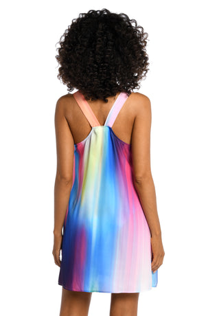 Model is wearing a multi colored ombre printed high neck mini dress cover up from our Sunset Shores collection!