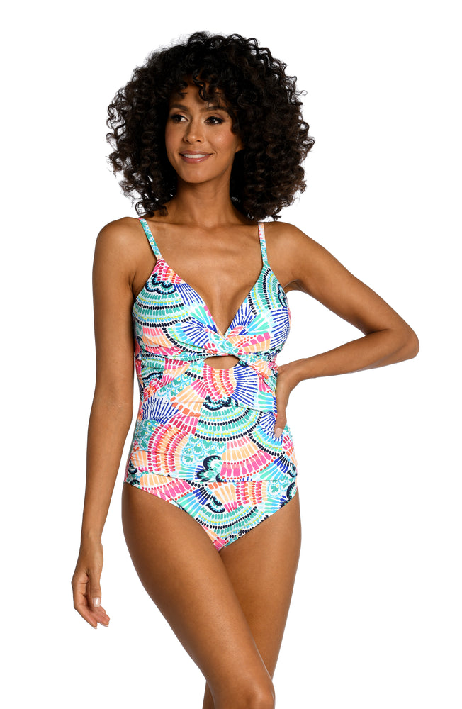
            
                Load image into Gallery viewer, Model is wearing a multi colored geometric printed keyhole one piece from our Waves of Color collection!
            
        