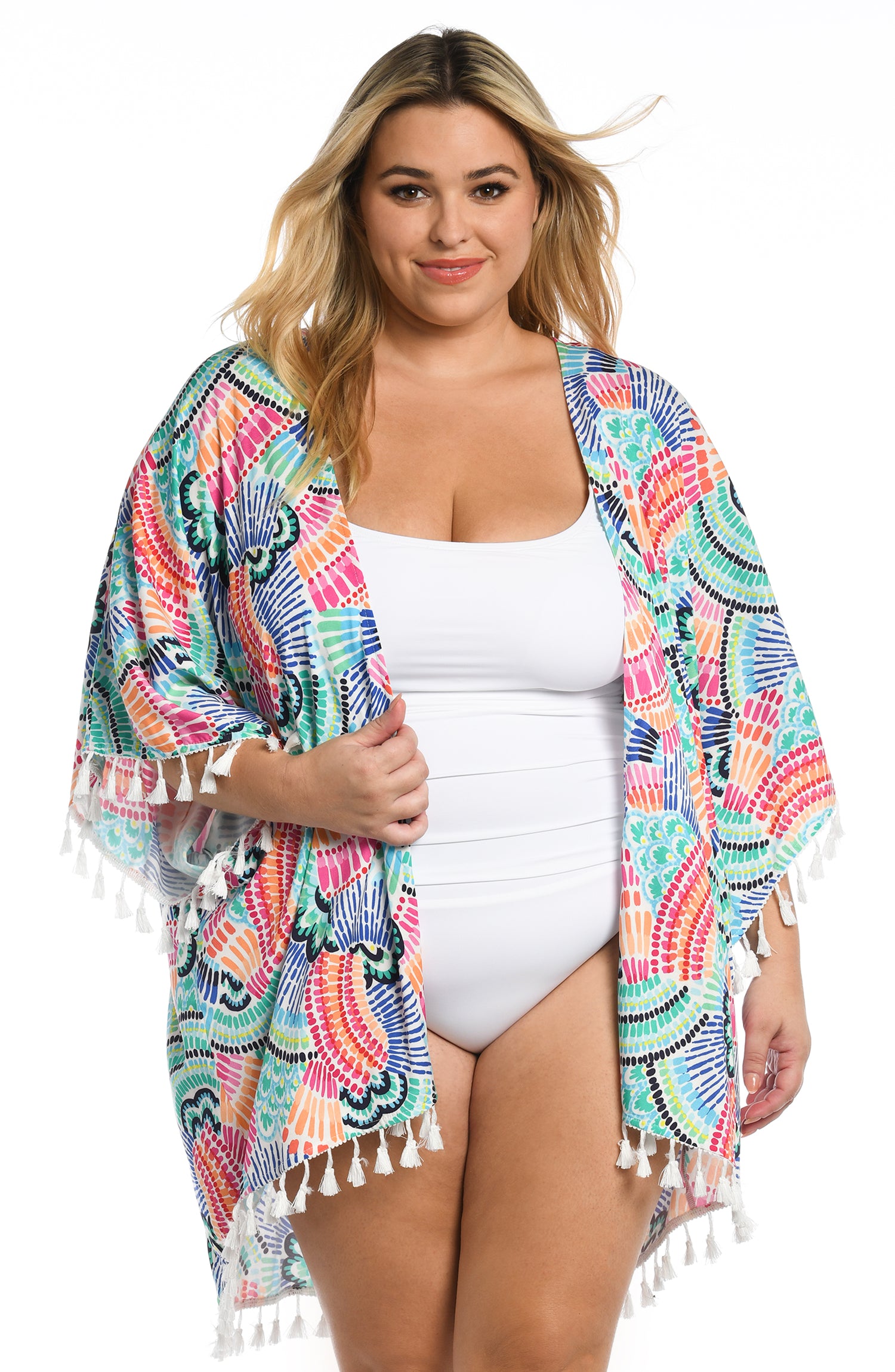 Model is wearing a multi colored geometric printed kimono cover up from our Waves of Color collection!