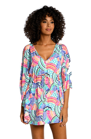 Model is wearing a multi colored geometric printed v-neck caftan cover up from our Waves of Color collection!