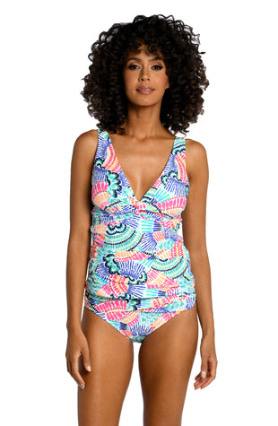 Model is wearing a multi colored geometric printed tankini top from our Waves of Color collection!
